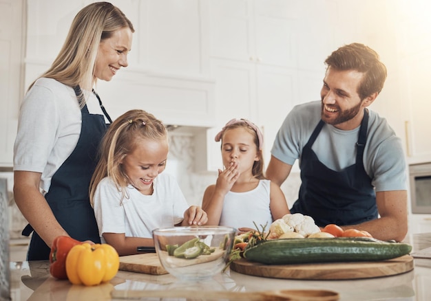 happy family cooking together in kitchen
